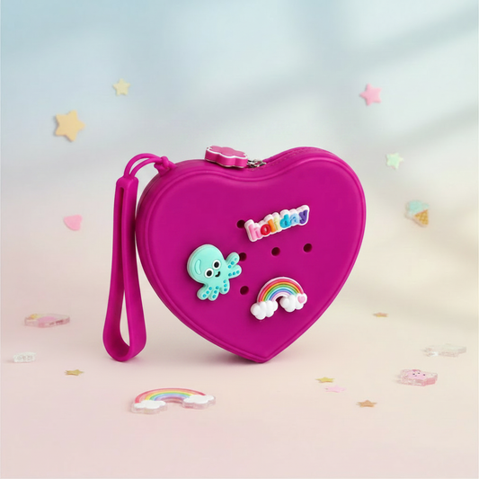 Fuschia heart-shaped silicone purse on a soft pastel background
