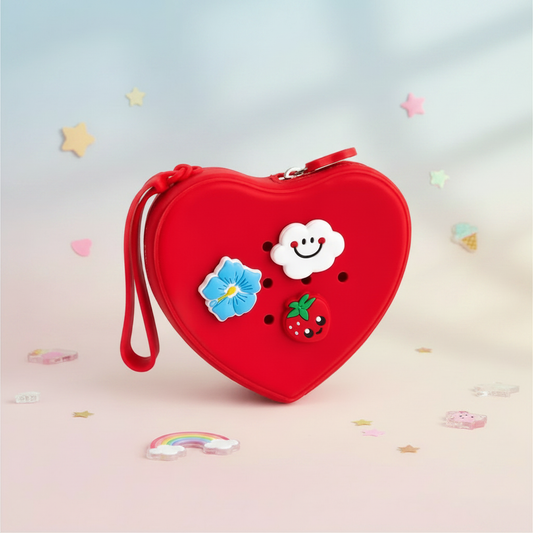Red heart-shaped silicone purse on a soft pastel background